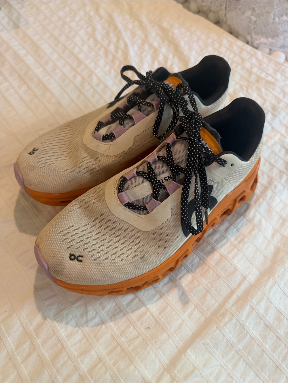 On Running Women's Cloud Shoes in Cream, Orange, and Black